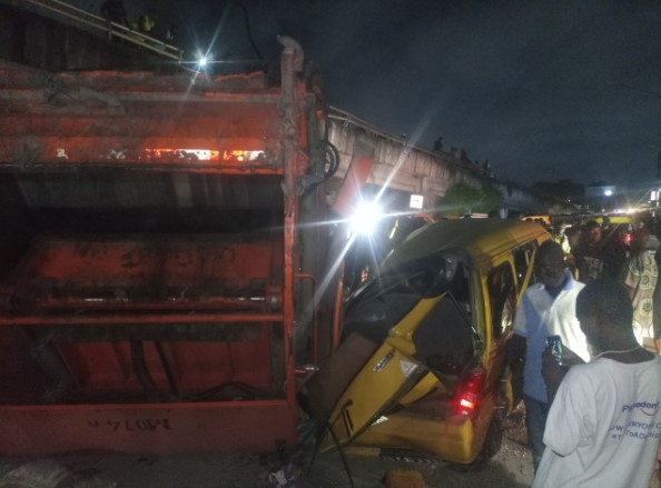 Refuse truck falls off Lagos bridge, kills tricycle rider